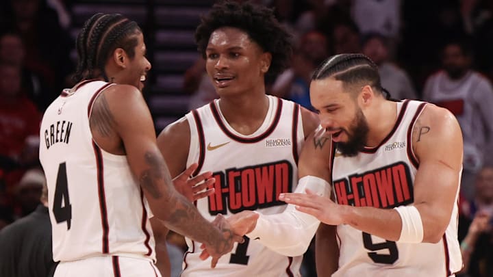 Feb 12, 2025; Houston, Texas, USA; Houston Rockets guard Jalen Green (4) and forward Amen Thompson (1) celebrate with forward Dillon Brooks (9) after a three point basket against the Phoenix Suns in the second half at Toyota Center. Mandatory Credit: Thomas Shea-Imagn Images
