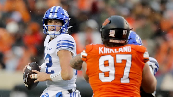 Nov 25, 2023; Stillwater, Oklahoma, USA; BYU's Jake Retzlaff (12) drops back to throw a pass during the first half against the Oklahoma State University Cowboys at Boone Pickens Stadium. Mandatory Credit: Sarah Phipps-Imagn Images Nov 25, 2023; Stillwater, Oklahoma, USA; BYU's Jake Retzlaff (12) drops back to throw a pass during the first half against the Oklahoma State University Cowboys at Boone Pickens Stadium. Mandatory Credit: Sarah Phipps-Imagn Images