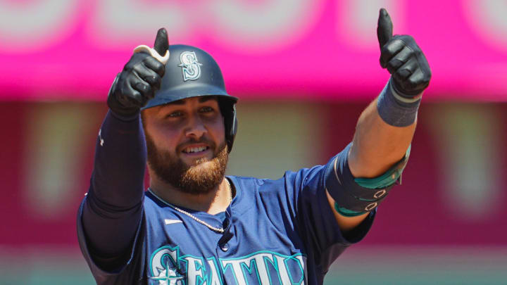 Seattle Mariners first baseman Tyler Locklear (27) gestures to the dugout after hitting a double during the seventh inning against the Kansas City Royals at Kauffman Stadium on June 9. Seattle Mariners first baseman Tyler Locklear (27) gestures to the dugout after hitting a double during the seventh inning against the Kansas City Royals at Kauffman Stadium on June 9.