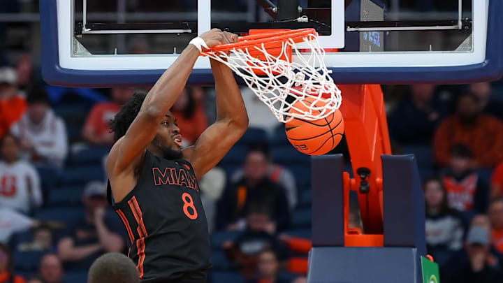 Jan 24, 2026; Syracuse, New York, USA; Miami Hurricanes center Ernest Udeh Jr. (8) dunks during the second half against the Syracuse Orange at the JMA Wireless Dome. Mandatory Credit: Rich Barnes-Imagn Images
