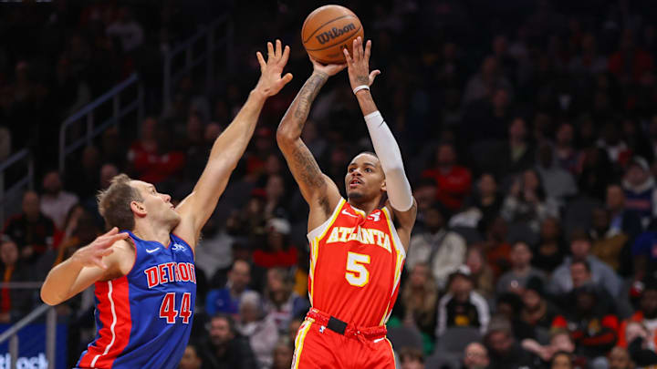 Dec 18, 2023; Atlanta, Georgia, USA; Atlanta Hawks guard Dejounte Murray (5) shoots past Detroit