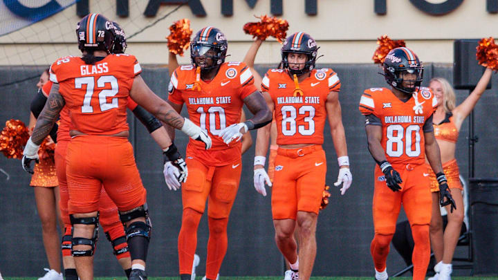 Sep 21, 2024; Stillwater, Oklahoma, USA; Oklahoma State Cowboys wide receiver Rashod Owens (10) celebrates after a touchdown during the fourth quarter against the Utah Utes at Boone Pickens Stadium. Mandatory Credit: William Purnell-Imagn Images
