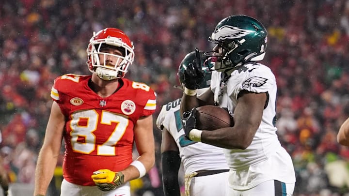 Philadelphia Eagles linebacker Nicholas Morrow (41) celebrates after recovering a fumble as Kansas City Chiefs tight end Travis Kelce (87) reacts.
