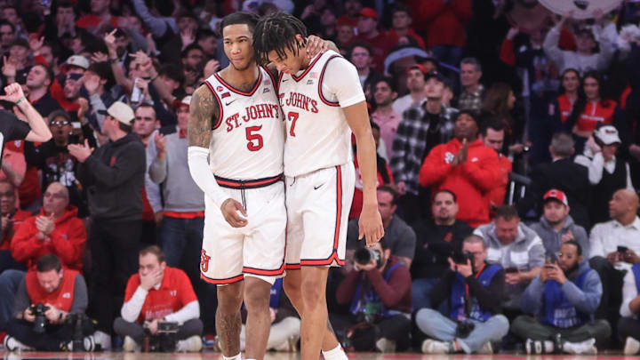 Feb 23, 2025; New York, New York, USA;  St. John's basketball guards Deivon Smith (5) and Simeon Wilcher (7) walk off the court in the closing seconds of the second half against the Connecticut Huskies at Madison Square Garden.