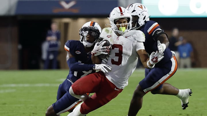 Sep 20, 2025; Charlottesville, Virginia, USA; Stanford Cardinal wide receiver C.J. Williams (3) catches a pass in front of Virginia Cavaliers cornerback Emmanuel Karnley (19) and Cavaliers linebacker Kam Robinson (5) during the fourth quarter at Scott Stadium. Mandatory Credit: Geoff Burke-Imagn Images Sep 20, 2025; Charlottesville, Virginia, USA; Stanford Cardinal wide receiver C.J. Williams (3) catches a pass in front of Virginia Cavaliers cornerback Emmanuel Karnley (19) and Cavaliers linebacker Kam Robinson (5) during the fourth quarter at Scott Stadium. Mandatory Credit: Geoff Burke-Imagn Images