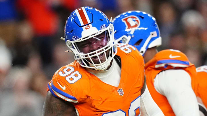 Nov 6, 2025; Denver, Colorado, USA; Denver Broncos defensive end John Franklin-Myers (98) reacts against the Las Vegas Raiders during the first half at Empower Field at Mile High. Mandatory Credit: Ron Chenoy-Imagn Images