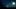A man with a torch standing in the countryside on a misty summer night. With glowing UFO lights floating in the sky. A man with a torch standing in the countryside on a misty summer night. With glowing UFO lights floating in the sky.