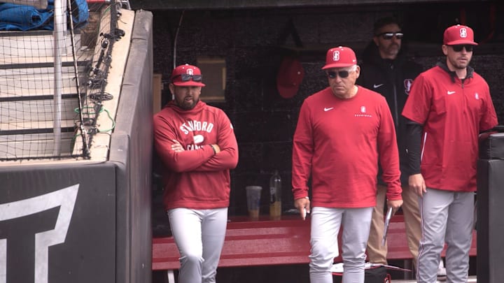 Stanford's head baseball coach David Esquer, center, stands in the dugout during game two of their non-conference baseball series against Texas Tech, Tuesday, April 2, 2024, at Rip Griffin Park.