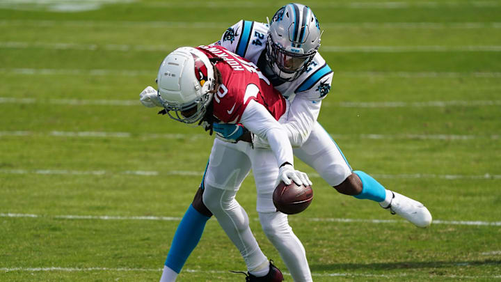 Oct 4, 2020; Charlotte, North Carolina, USA; Carolina Panthers cornerback Rasul Douglas (24) tackles Arizona Cardinals wide receiver DeAndre Hopkins (10) during the second quarter at Bank of America Stadium. Mandatory Credit: Jim Dedmon-Imagn Images Oct 4, 2020; Charlotte, North Carolina, USA; Carolina Panthers cornerback Rasul Douglas (24) tackles Arizona Cardinals wide receiver DeAndre Hopkins (10) during the second quarter at Bank of America Stadium. Mandatory Credit: Jim Dedmon-Imagn Images