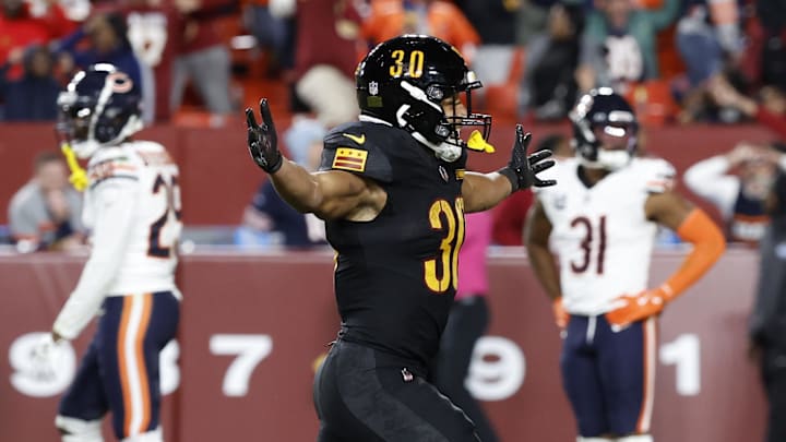 The celebrating begins for Austin Ekeler and the Commanders while the Bears can only be disgusted after their 18-15 loss.