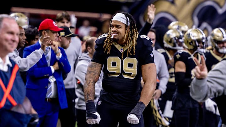 Dec 15, 2024; New Orleans, Louisiana, USA;  New Orleans Saints defensive end Chase Young (99) reacts to a score against the Washington Commanders during the second half at Caesars Superdome. Mandatory Credit: Stephen Lew-Imagn Images