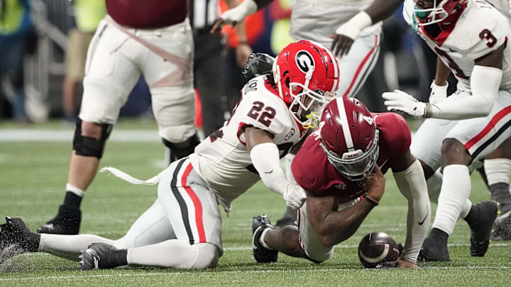Georgia Bulldogs defensive back Javon Bullard (22) forces a fumble by Alabama quarterback Jalen Milroe