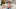 Woman clutching stomach with a pained expression Woman clutching stomach with a pained expression