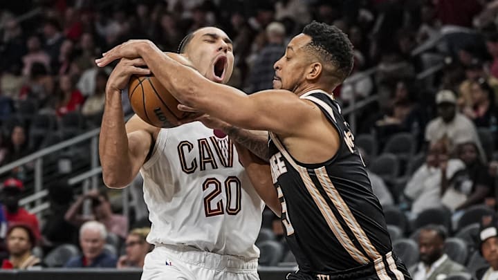 Apr 10, 2026; Atlanta, Georgia, USA; Cleveland Cavaliers guard Jaylon Tyson (20) tries to drive to the basket against Atlanta Hawks guard CJ McCollum (3) during the second half at State Farm Arena. Mandatory Credit: Dale Zanine-Imagn Images