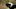 Boy (6-7) hugging black Newfoundland outdoors Boy (6-7) hugging black Newfoundland outdoors