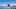 Boy jumping into lake with toy whale Boy jumping into lake with toy whale