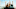 Rear view of couple with arms raised about to begin descent on roller coaster in amusement park Rear view of couple with arms raised about to begin descent on roller coaster in amusement park