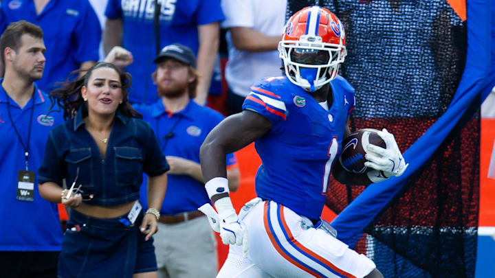 Florida Gators running back Montrell Johnson Jr. (1) breaks for a touchdown during the season opener at Ben Hill Griffin Stadium in Gainesville, FL on Saturday, August 31, 2024 against the University of Miami Hurricanes in the first half. Miami lead 24-10 at the half. [Doug Engle/Gainesville Sun]