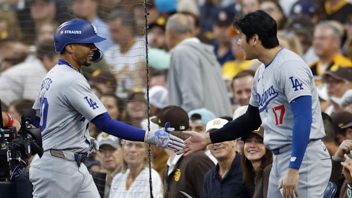 Oct 8, 2024; San Diego, California, USA; Los Angeles Dodgers shortstop Mookie Betts (50) celebrates with designated hitter Shohei Ohtani (17) after hitting a home run in the first inning during game three of the NLDS for the 2024 MLB Playoffs against the San Diego Padres at Petco Park. Mandatory Credit: David Frerker-Imagn Images