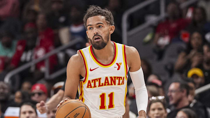 Nov 9, 2024; Atlanta, Georgia, USA; Atlanta Hawks guard Trae Young (11) controls the ball against the Chicago Bulls during the first half at State Farm Arena. Mandatory Credit: Dale Zanine-Imagn Images