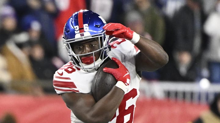 Dec 1, 2025; Foxborough, Massachusetts, USA; New York Giants running back Devin Singletary (26) runs the ball during the second quarter against the New England Patriots at Gillette Stadium.  