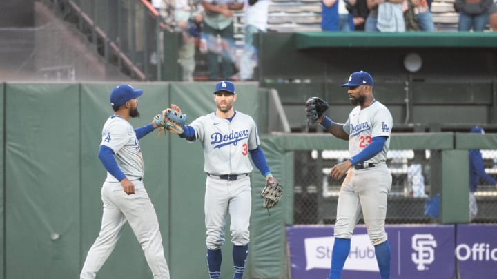 Jun 29, 2024; San Francisco, California, USA; Los Angeles Dodgers catcher Will Smith (16) and outfielder Chris Taylor (3) and outfielder Jason Heyward (23) celebrate after defeating the San Francisco Giants at Oracle Park. Mandatory Credit: Ed Szczepanski-USA TODAY Sports