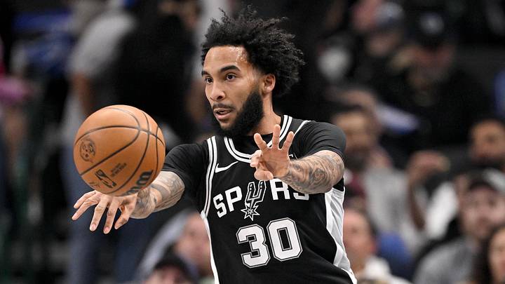 Feb 5, 2026; Dallas, Texas, USA; San Antonio Spurs forward Julian Champagnie (30) passes the ball during the first quarter against the Dallas Mavericks at the American Airlines Center.