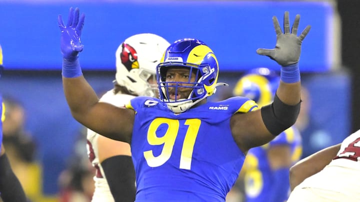 Dec 28, 2024; Inglewood, California, USA;  Los Angeles Rams defensive tackle Kobie Turner (91) celebrates after sackiing Arizona Cardinals quarterback Kyler Murray (1) in the second half at SoFi Stadium. Mandatory Credit: Jayne Kamin-Oncea-Imagn Images