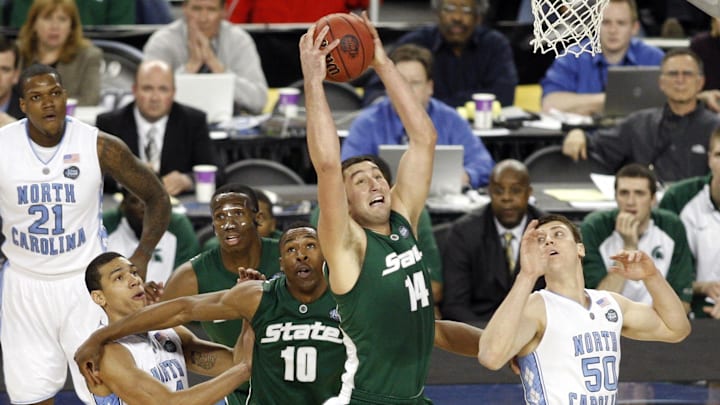 Apr 6, 2009; Detroit, MI, USA; Michigan State Spartans center Goran Suton (14) rebounds against North Carolina Tar Heels forward Tyler Hansbrough (50) during the first half of the championship game of the Final Four in the 2009 NCAA mens basketball tournament at Ford Field. Mandatory Credit: Bob Donnan-Imagn Images