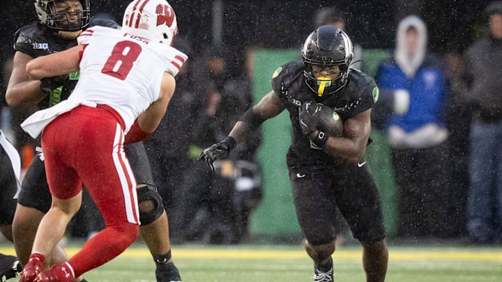 Wisconsin Badgers freshman linebacker Mason Posa comes off a block with eyes on Oregon running back Jordon Davison carrying the ball on Oct. 25, 2025, at Autzen Stadium in Eugene, Oregon. Wisconsin Badgers freshman linebacker Mason Posa comes off a block with eyes on Oregon running back Jordon Davison carrying the ball on Oct. 25, 2025, at Autzen Stadium in Eugene, Oregon.