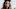 Woman Putting On Evil Clown Makeup for Halloween Woman Putting On Evil Clown Makeup for Halloween