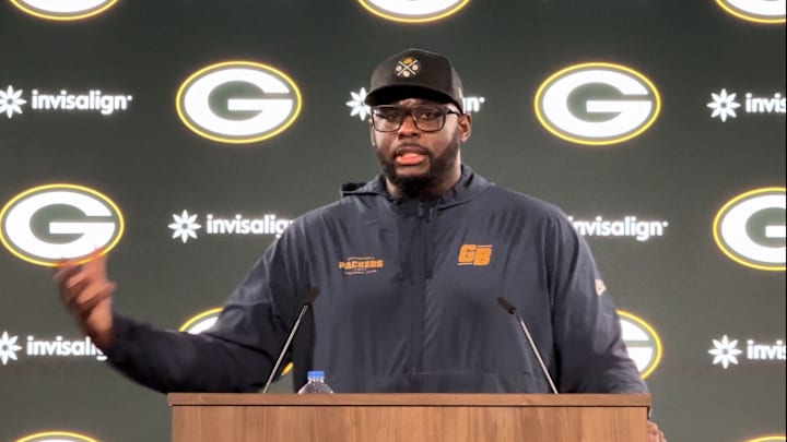 Packers defensive line coach Vince Oghobaase 