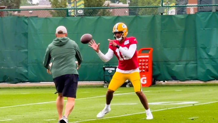 Jordan Love catches a toss from a coach before throwing the ball at practice on Thursday.