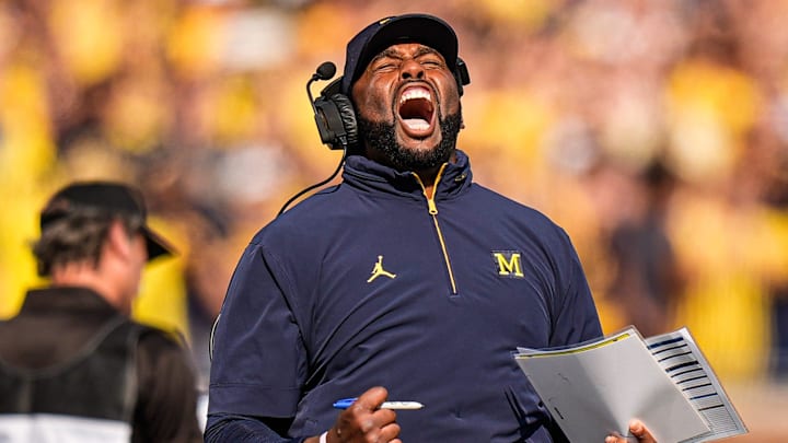 Michigan head coach Sherrone Moore cheers on before a play against Washington during the first half at Michigan Stadium in Ann Arbor on Saturday, Oct. 18, 2025.