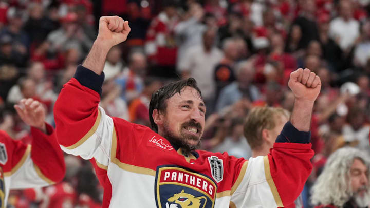 Jun 17, 2025; Sunrise, Florida, USA; Florida Panthers center Brad Marchand (63) celebrates with his teammates after winning game six of the 2025 Stanley Cup Final against the Edmonton Oilers at Amerant Bank Arena. Mandatory Credit: Jim Rassol-Imagn Images