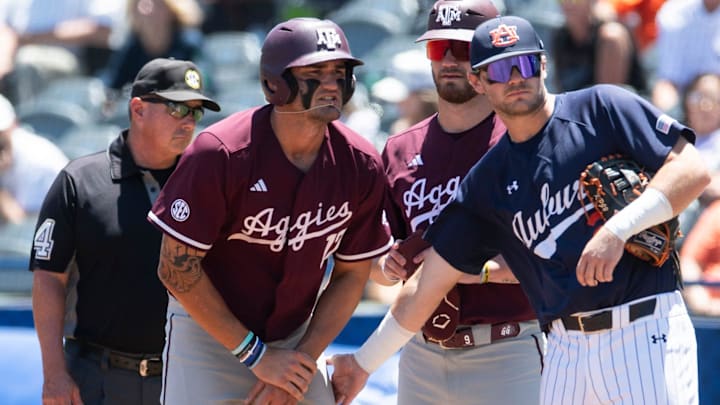 Auburn Tigers' Cooper McMurray (26) encourages Texas A&M Aggies' Jace LaViolette (17) after LaViolette got hit in the hands by a pitch as Auburn Tigers take on Texas A&M Aggies during the SEC baseball tournament at Hoover Met in Birmingham, Ala., on Thursday, May 22, 2025.