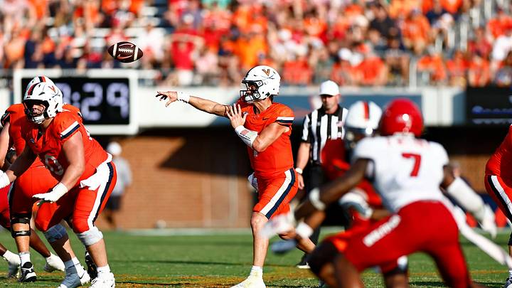 Virginia Cavaliers quarterback Beau Pribula throws for a first down against NC State. Virginia Cavaliers quarterback Beau Pribula throws for a first down against NC State.