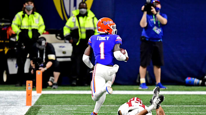 Dec 19, 2020; Atlanta, Georgia, USA; Florida Gators wide receiver Kadarius Toney (1) catches a touchdown pass against Alabama Crimson Tide defensive back Malachi Moore (13) during the first quarter in the SEC Championship at Mercedes-Benz Stadium. Mandatory Credit: Adam Hagy-Imagn Images