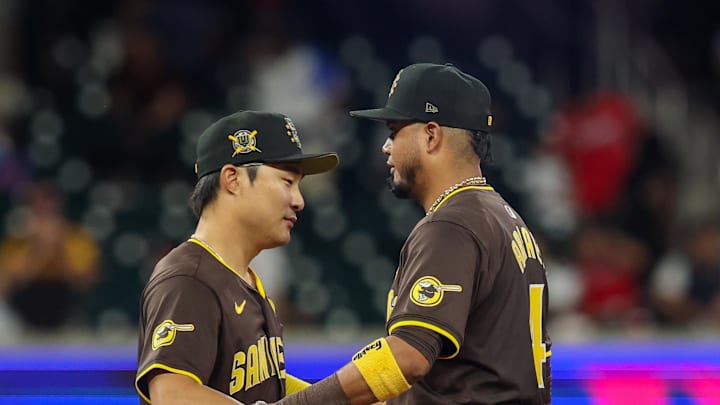 May 19, 2024; Atlanta, Georgia, USA; San Diego Padres shortstop Ha-Seong Kim (7) and second baseman Luis Arraez (4) celebrate after a victory against the Atlanta Braves at Truist Park. Mandatory Credit: Brett Davis-USA TODAY Sports May 19, 2024; Atlanta, Georgia, USA; San Diego Padres shortstop Ha-Seong Kim (7) and second baseman Luis Arraez (4) celebrate after a victory against the Atlanta Braves at Truist Park. Mandatory Credit: Brett Davis-USA TODAY Sports