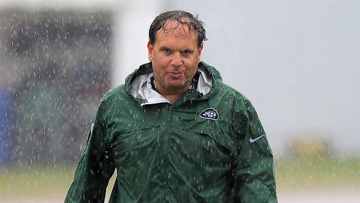 July 28, 2012; Cortland, NY, USA; New York Jets general manager Mike Tannenbaum walks off the field following training camp.
