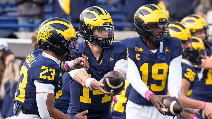 Michigan quarterback Tommy Carr (14) warms up with running back Jordan Marshall (23) ahead of the game between Michigan and Indiana at Michigan Stadium in Ann Arbor on Saturday, Oct. 24, 2026.