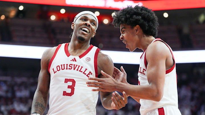 Louisville Cardinals guard Ryan Conwell (3) laughs with Louisville Cardinals guard Mikel Brown Jr. (0) in the first half at the KFC Yum! Center in downtown Louisville February 9, 2026.