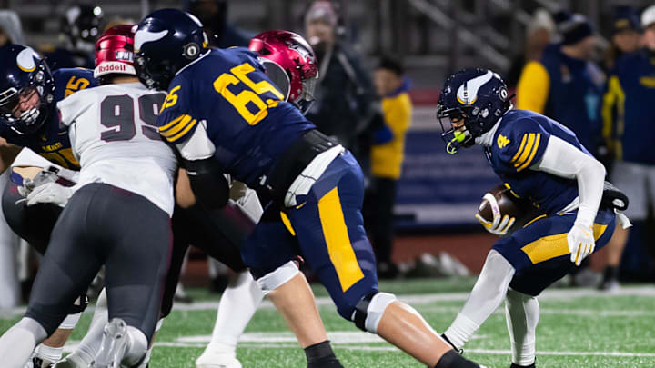 Central Catholic's Elijah Faulkner runs into a wall while trying to carry the ball in the first half of the PIAA Class 6A football championship game against St. Joseph's Prep at Cumberland Valley High School, Saturday, Dec. 7, 2024, in Silver Spring Township, Pa.