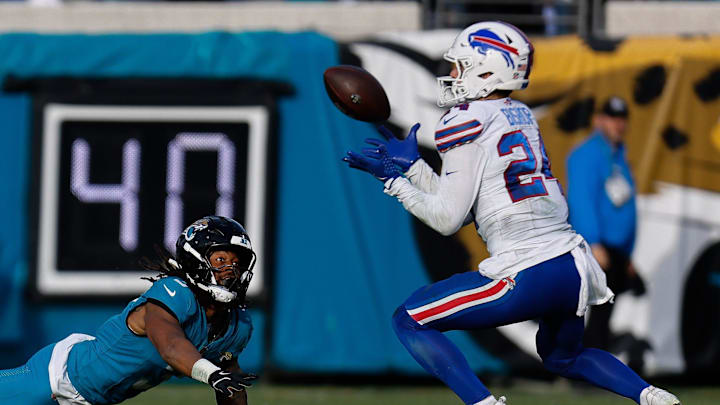 Jacksonville Jaguars wide receiver Jakobi Meyers (3) can only watch as Buffalo Bills safety Cole Bishop (24) intercepts the ball on the last play of the game in an NFL football AFC Wild Card playoff matchup, Sunday, Jan. 11, 2026, in Jacksonville, Fla. Bills lead 10-7 at the half over the Jaguars. The Bills defeated the Jaguars 27-24. [Doug Engle/Florida Times-Union]