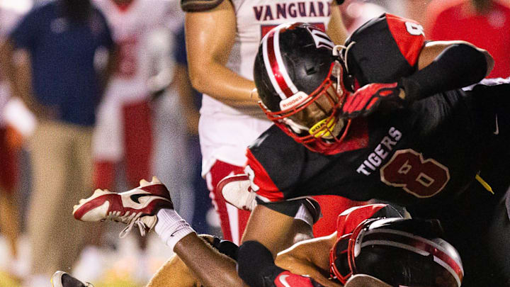 Vanguard Knights Terrance Lewis (18) is brought down by Dunnellon Tigers Kaiden Robinson-Vickers (8) and Dunnellon Tigers Dylan Donahoe (5). The Dunnellon Tigers hosted the Vanguard Knights at Dunnellon High School in Dunnellon, FL on Friday, September 20, 2024.