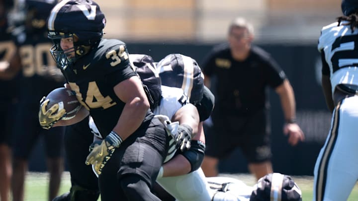 Vanderbilt running back Johann Cardenas (34) runs during the Vanderbilt Football Black and Gold Spring Game at FirstBank Stadium in Nashville, Tenn., Saturday, April 12, 2025.