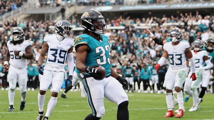 Jan 4, 2026; Jacksonville, Florida, USA; Jacksonville Jaguars running back Bhayshul Tuten (33) runs for a five-yard touchdown against the Tennessee Titans during the fourth quarter at EverBank Stadium. Mandatory Credit: Morgan Tencza-Imagn Images Jan 4, 2026; Jacksonville, Florida, USA; Jacksonville Jaguars running back Bhayshul Tuten (33) runs for a five-yard touchdown against the Tennessee Titans during the fourth quarter at EverBank Stadium. Mandatory Credit: Morgan Tencza-Imagn Images