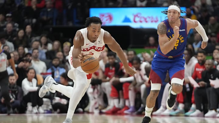 Oct 28, 2024; Toronto, Ontario, CAN; Toronto Raptors forward Scottie Barnes (4) drives to the net as Denver Nuggets forward Aaron Gordon (32) pursues during the second half at Scotiabank Arena.