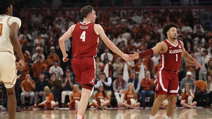 Alabama forward Grant Nelson (4) and Alabama guard Mark Sears (1) celebrate against Texas at Moody Center in Austin, TX on Tuesday, Feb 11, 2025. / Photo by Crimson Tide Photos / UA Athletics