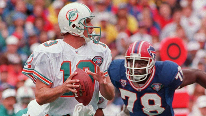 Bills DE Bruce Smith rushes Miami quarterback Dan Marino on Oct. 9, 1994.